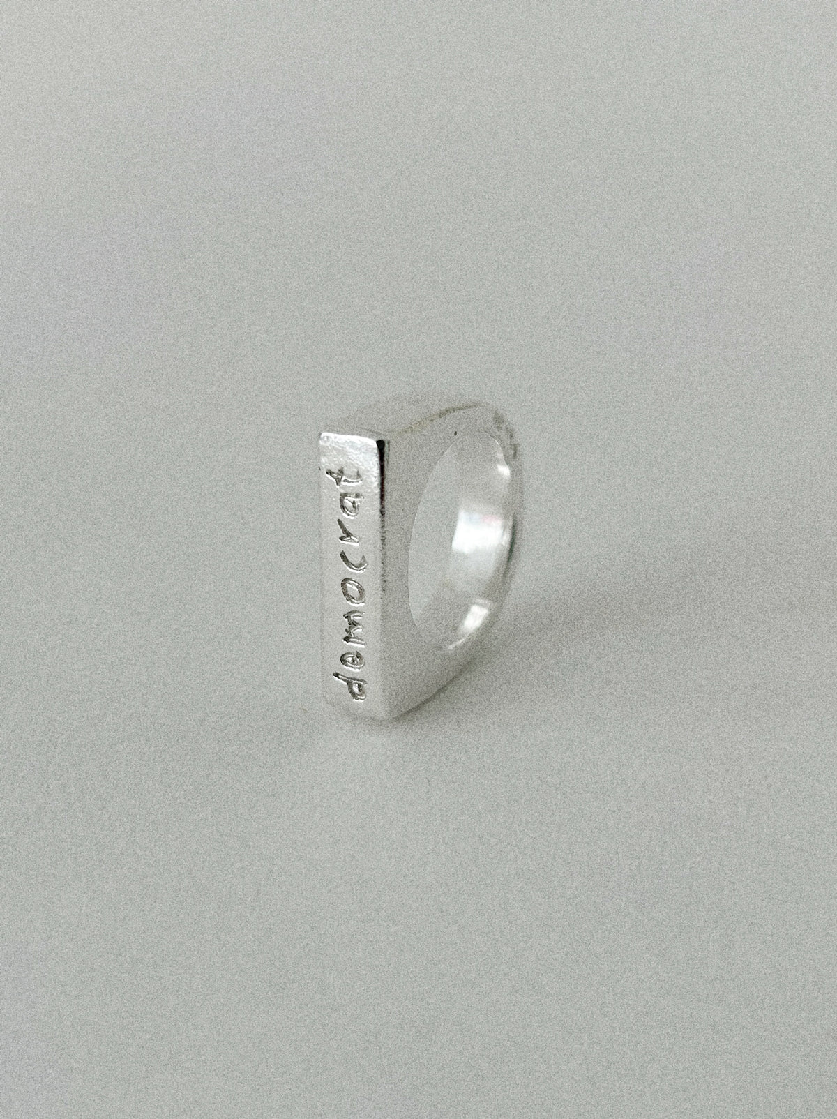 'DEMOCRAT' SIGNET RING (WRITTEN)