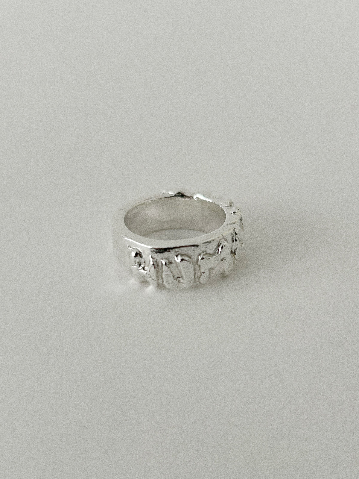 'HUMANIST' ROUND RING (MOLTEN)