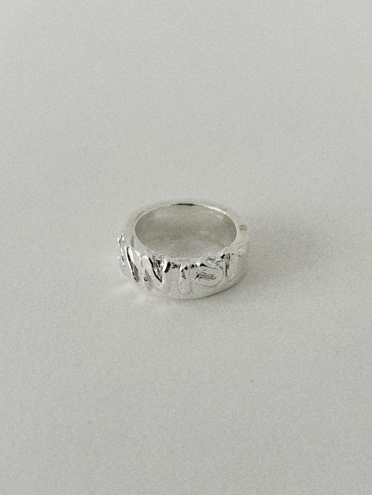 'HUMANIST' ROUND RING (MOLTEN)