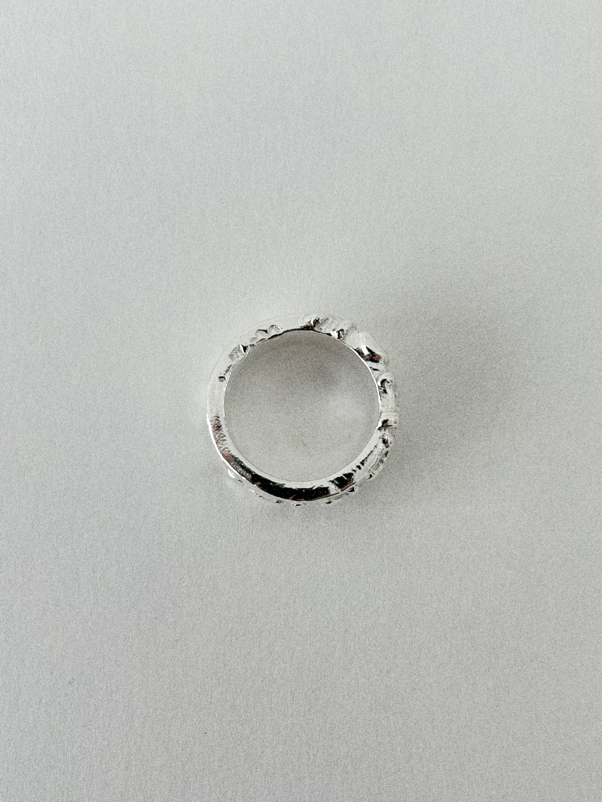 'HUMANIST' ROUND RING (MOLTEN)